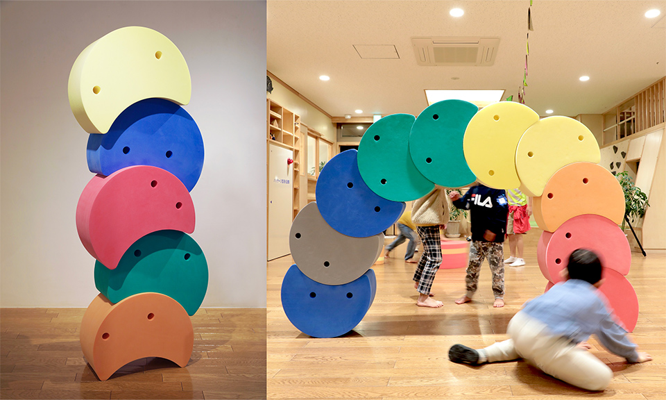 「つむまる」サイズ:450×250×400mm、素材:ポリエチレンフォーム、作品説明:自由に積み重ねたり、並べたりして子どもが頭で考えながら身体全体を使って遊び方をみつけることができる知育遊具です
